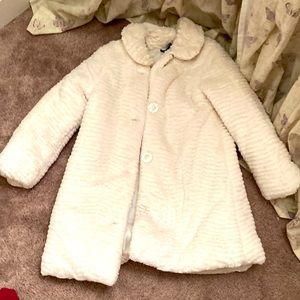 A white fluffy winter jacket